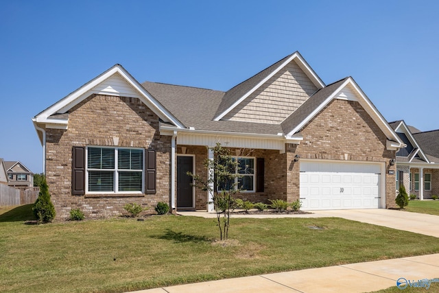 craftsman-style house with a garage and a front lawn