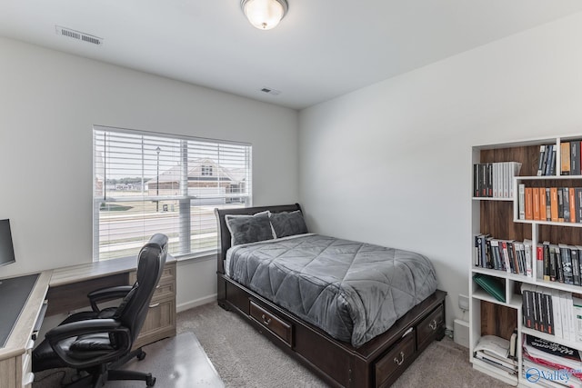 bedroom with light colored carpet