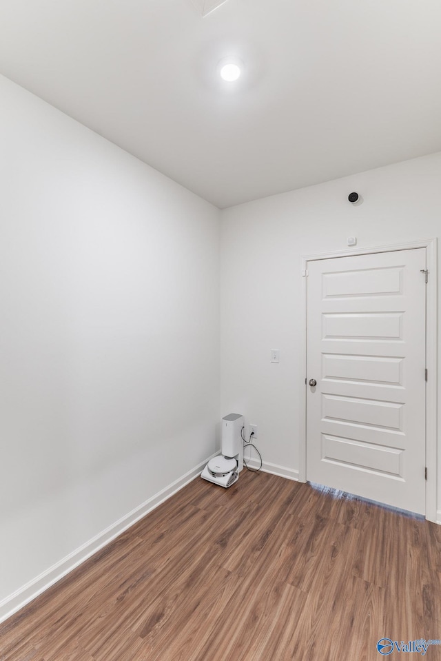 empty room with hardwood / wood-style floors