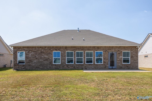 back of house featuring a yard and a patio area