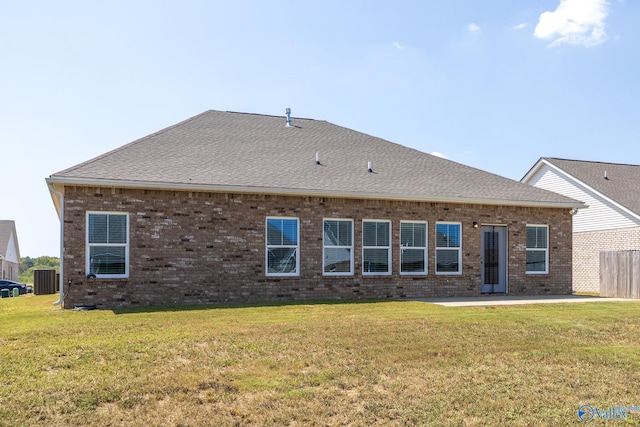 back of house featuring a yard, a patio, and central air condition unit