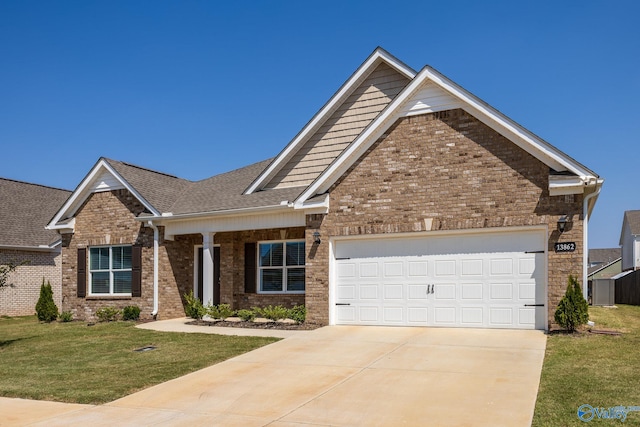 craftsman inspired home featuring a front lawn and a garage