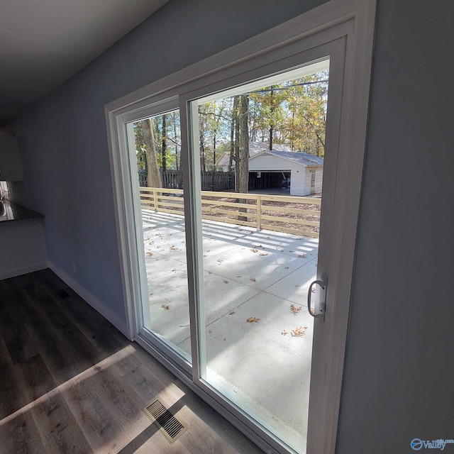 entryway with wood-type flooring