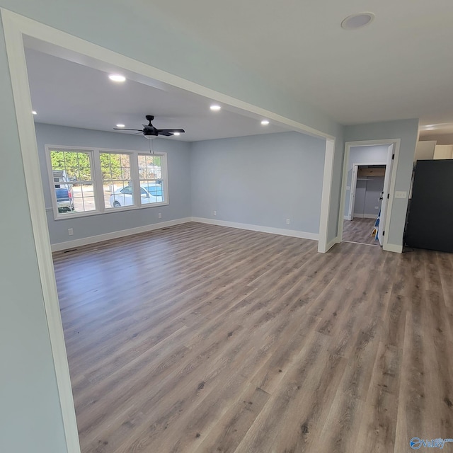 unfurnished living room with ceiling fan and light hardwood / wood-style floors