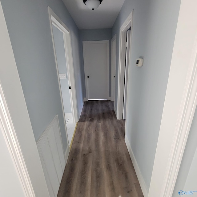 hallway featuring dark wood-type flooring