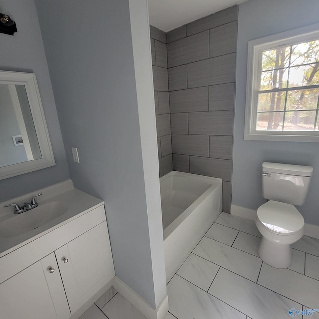 full bathroom featuring vanity, toilet, and tiled shower / bath combo