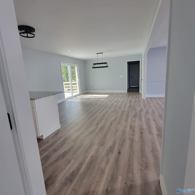 unfurnished living room featuring light wood-type flooring