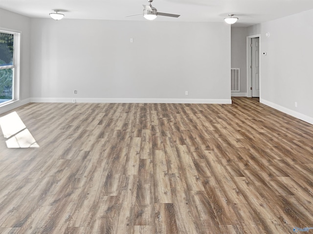 unfurnished room featuring wood-type flooring and ceiling fan