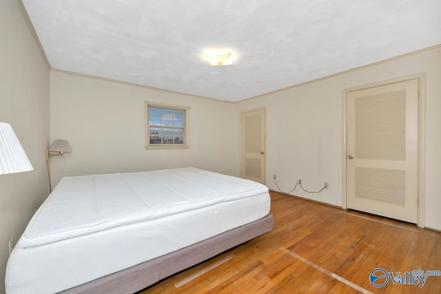 bedroom featuring hardwood / wood-style floors