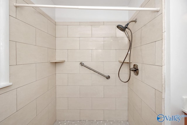 bathroom with tiled shower