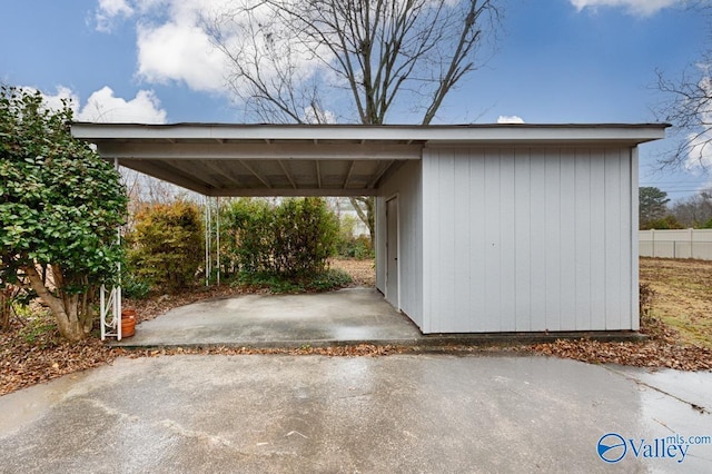 view of parking / parking lot featuring a carport