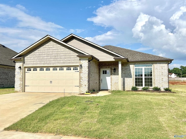 craftsman-style house with a front lawn, brick siding, a garage, and driveway