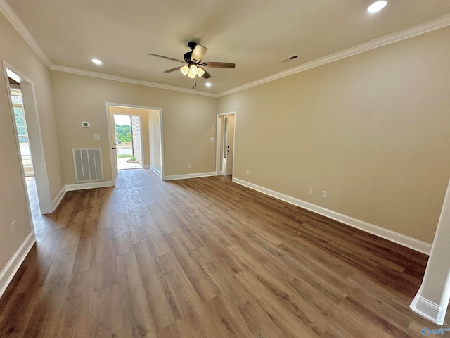 unfurnished living room with ceiling fan, hardwood / wood-style flooring, and ornamental molding