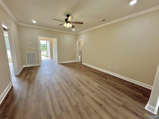 spare room with visible vents, baseboards, ceiling fan, and wood finished floors