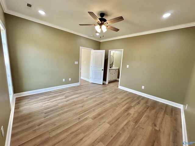 unfurnished room featuring ceiling fan, crown molding, and light hardwood / wood-style floors