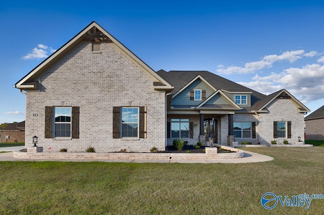 craftsman-style home with a front lawn