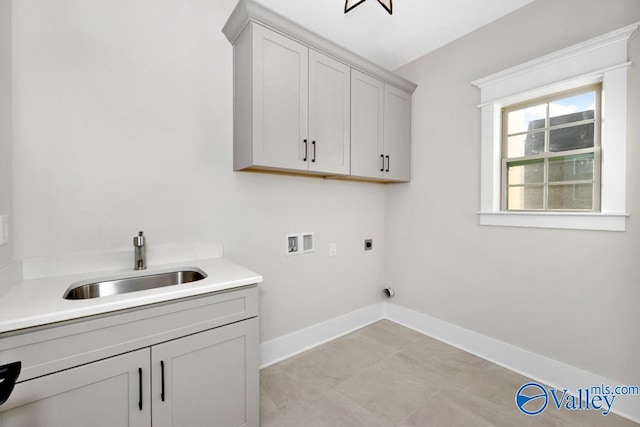 laundry room featuring hookup for a washing machine, sink, hookup for an electric dryer, and cabinets