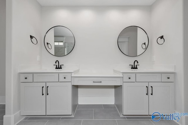 bathroom with vanity and tile patterned flooring