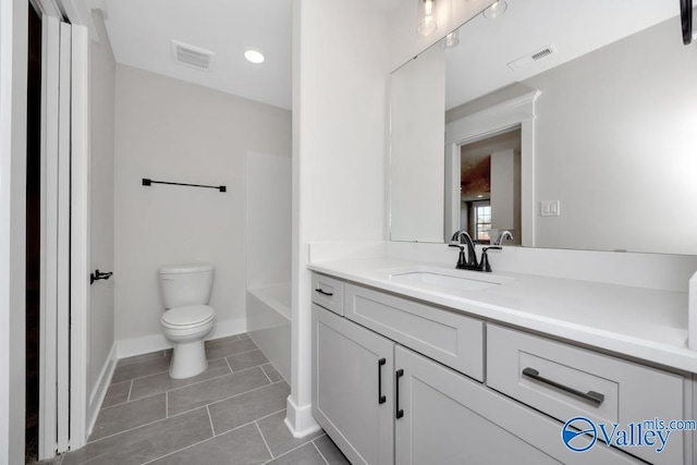 bathroom with tile patterned floors, toilet, and vanity