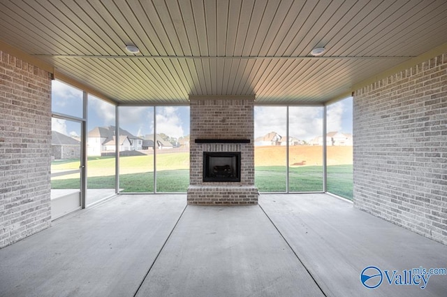 view of patio / terrace featuring an outdoor brick fireplace