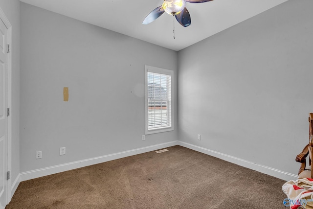 empty room featuring ceiling fan and carpet floors