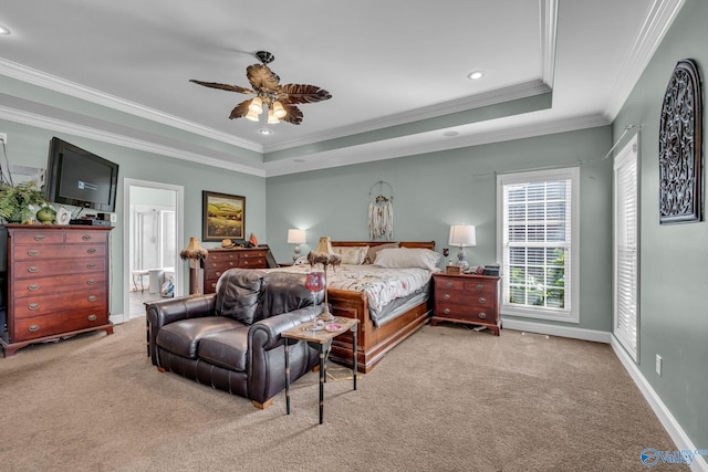 bedroom with light colored carpet, a raised ceiling, ceiling fan, and ornamental molding