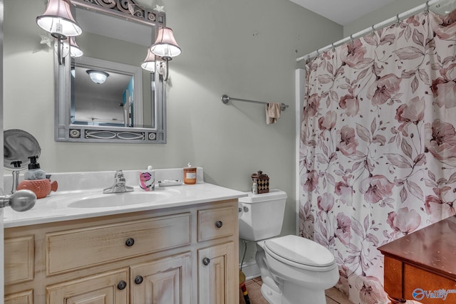 bathroom with vanity, toilet, and walk in shower