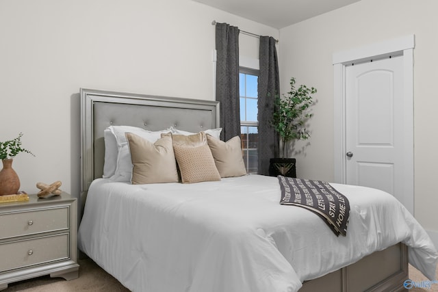 bedroom featuring carpet