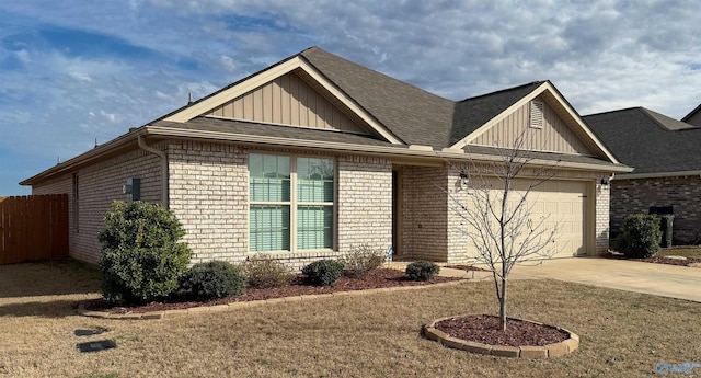 view of front of house featuring a garage and a front yard