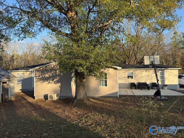 rear view of property with a patio area