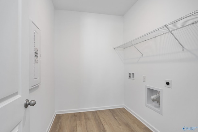 laundry room with hardwood / wood-style flooring, washer hookup, and electric dryer hookup