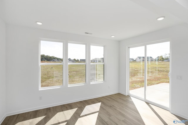 empty room with light wood-type flooring