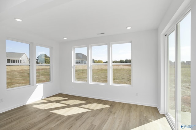 unfurnished sunroom featuring a healthy amount of sunlight