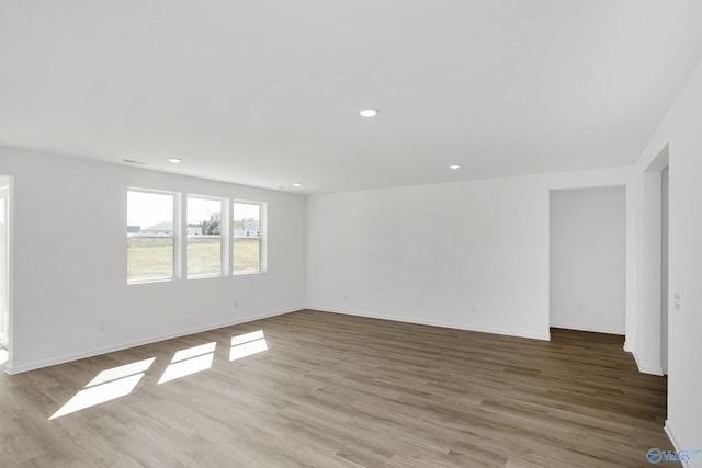 unfurnished room featuring light hardwood / wood-style flooring