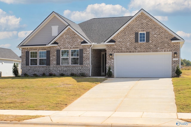 view of front facade with a garage and a front yard