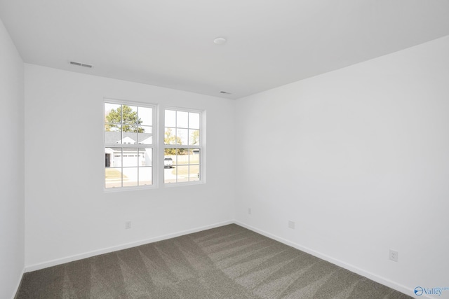 empty room featuring carpet flooring