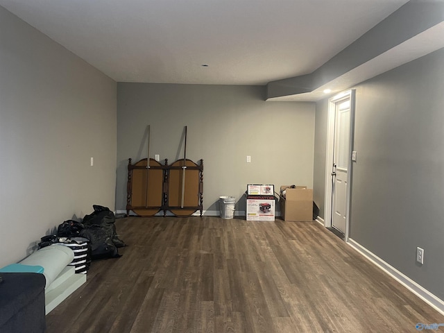 finished basement featuring baseboards and wood finished floors