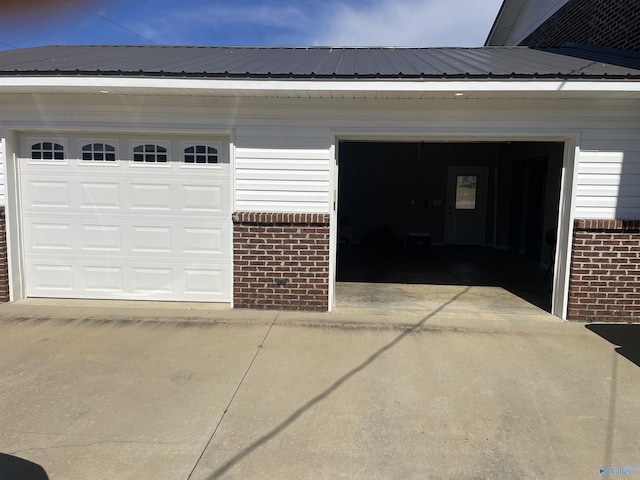 garage featuring driveway