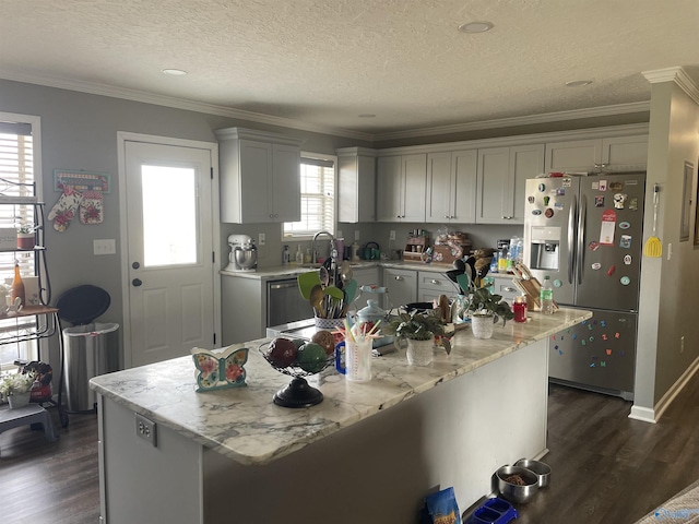 kitchen featuring a textured ceiling, dishwashing machine, ornamental molding, stainless steel fridge with ice dispenser, and dark wood-style floors