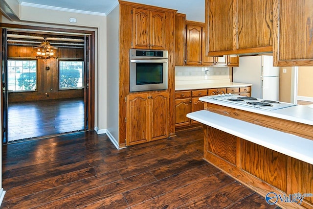 148 Maple Blvd, Gurley, AL 35748 - kitchen with ornamental molding, dark hardwood / wood-style flooring, backsplash, and white appliances