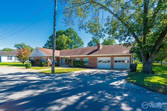 148 Maple Blvd, Gurley, AL 35748 - ranch-style home featuring a garage and a front yard