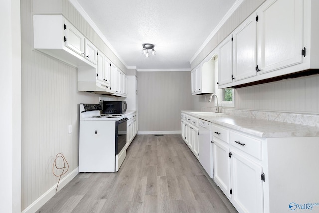 431 County Road 449, Town Creek, AL 35672 - kitchen featuring white appliances, a sink, light countertops, baseboards, and light wood-style floors