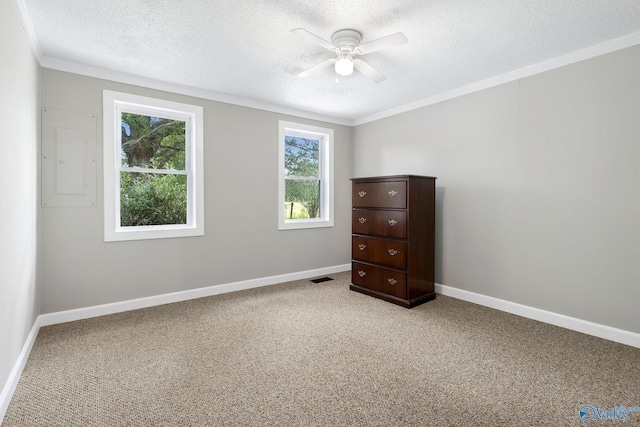 431 County Road 449, Town Creek, AL 35672 - unfurnished bedroom with a textured ceiling, carpet floors, ornamental molding, baseboards, and ceiling fan