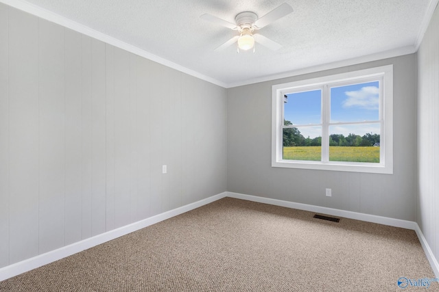 431 County Road 449, Town Creek, AL 35672 - carpeted spare room featuring a textured ceiling, ceiling fan, crown molding, and baseboards