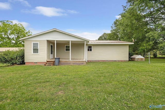 431 County Road 449, Town Creek, AL 35672 - rear view of house featuring crawl space, a yard, and metal roof