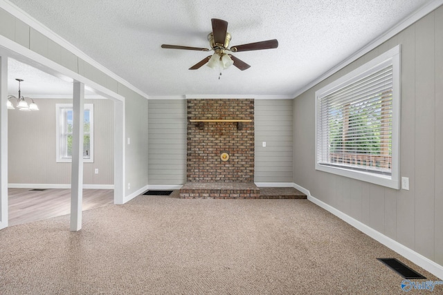 431 County Road 449, Town Creek, AL 35672 - unfurnished living room with plenty of natural light, carpet flooring, ornamental molding, a textured ceiling, and ceiling fan