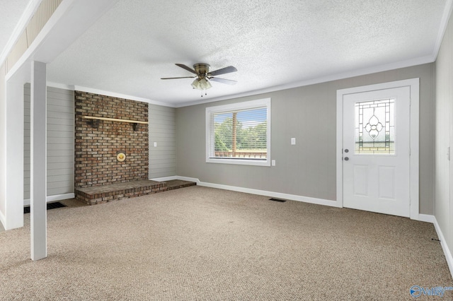 431 County Road 449, Town Creek, AL 35672 - unfurnished living room featuring ceiling fan, crown molding, carpet floors, a textured ceiling, and baseboards