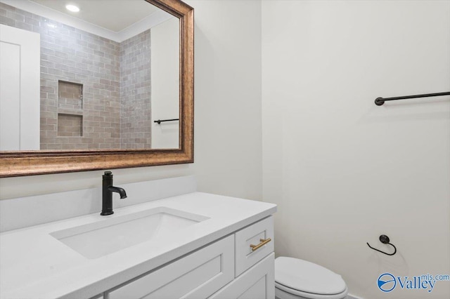 bathroom with vanity and toilet