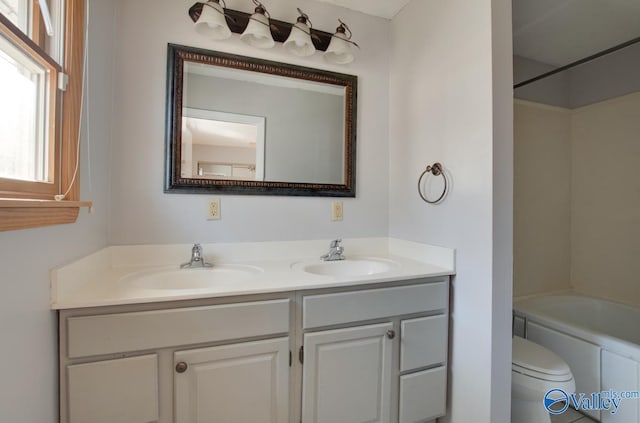 full bathroom with  shower combination, toilet, and vanity