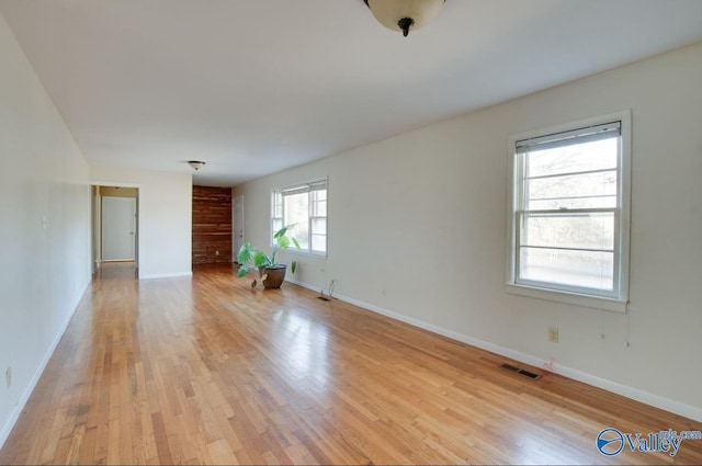 unfurnished room with light hardwood / wood-style flooring